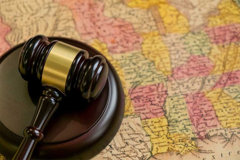 Judge's wooden gavel and United States map