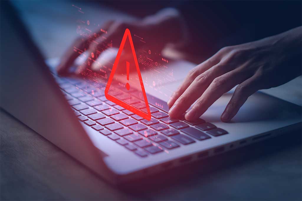 System compromised warning alert on laptop computer