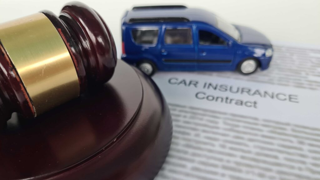 Gavel on car insurance contract representing Florida court ruling on PIP claims and Letters of Protection